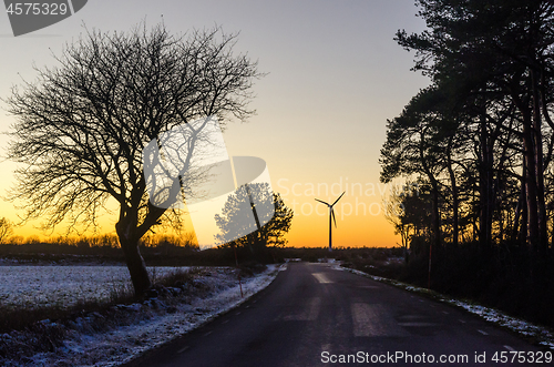 Image of Wind generator by a country road in winter season