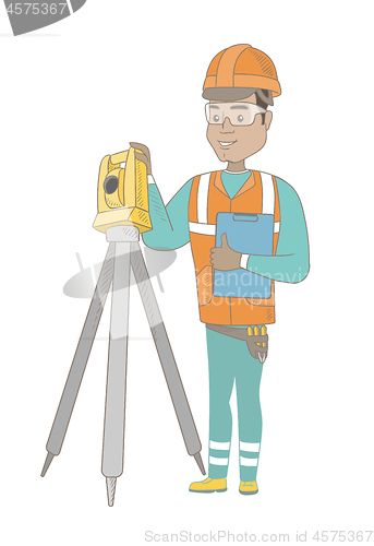 Image of Hispanic surveyor builder working with theodolite.