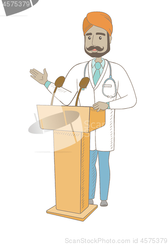 Image of Indian doctor giving a speech from tribune.