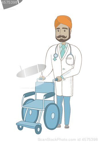 Image of Young indian doctor pushing wheelchair.