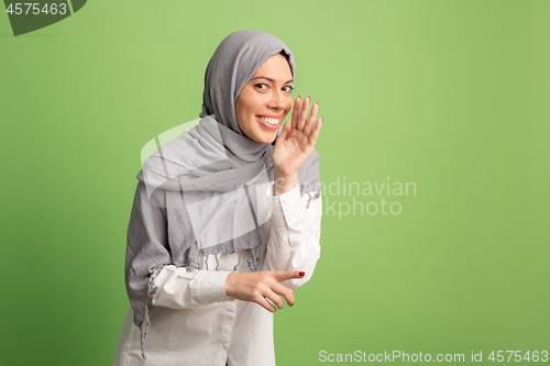 Image of Happy arab woman in hijab. Portrait of smiling girl, posing at studio background