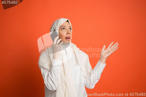 Image of Happy arab woman in hijab. Portrait of smiling girl, posing at studio background