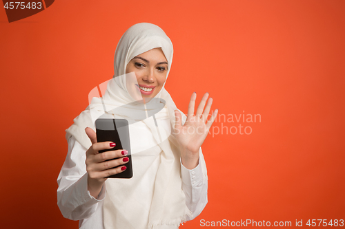 Image of Happy arab woman in hijab. Portrait of smiling girl, posing at studio background