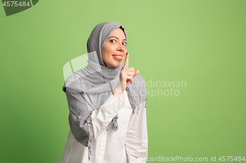 Image of Happy arab woman in hijab. Portrait of smiling girl, posing at studio background
