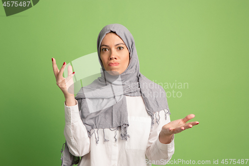 Image of Argue, arguing concept. arab woman in hijab. Portrait of girl, posing at studio background