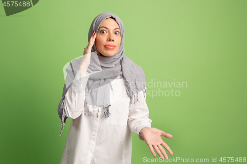 Image of Argue, arguing concept. arab woman in hijab. Portrait of girl, posing at studio background