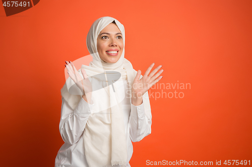 Image of Happy arab woman in hijab. Portrait of smiling girl, posing at studio background