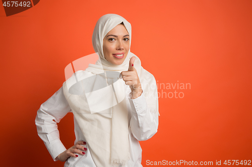 Image of Happy arab woman in hijab. Portrait of smiling girl, posing at studio background