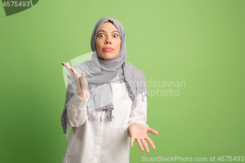 Image of Argue, arguing concept. arab woman in hijab. Portrait of girl, posing at studio background