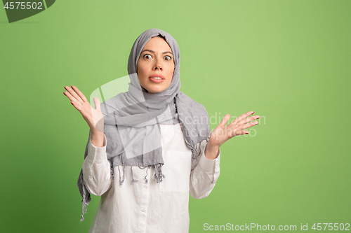 Image of Argue, arguing concept. arab woman in hijab. Portrait of girl, posing at studio background