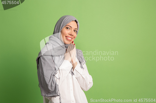 Image of Happy arab woman in hijab. Portrait of smiling girl, posing at studio background