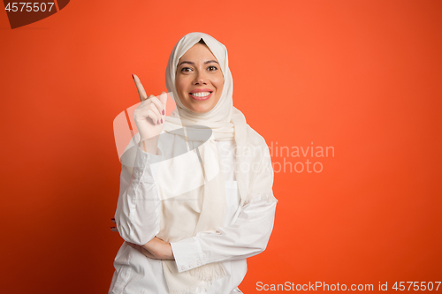Image of Happy arab woman in hijab. Portrait of smiling girl, posing at studio background