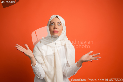 Image of Happy arab woman in hijab. Portrait of smiling girl, posing at studio background