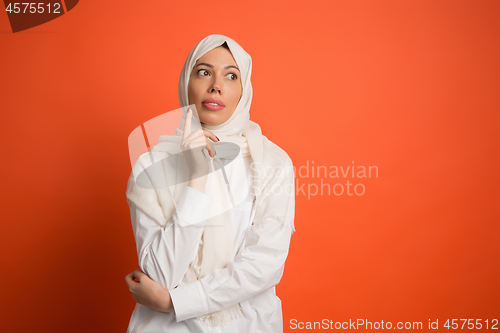 Image of The arab woman in hijab. Portrait of serious girl, posing at studio background