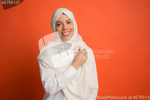 Image of Happy arab woman in hijab. Portrait of smiling girl, posing at studio background