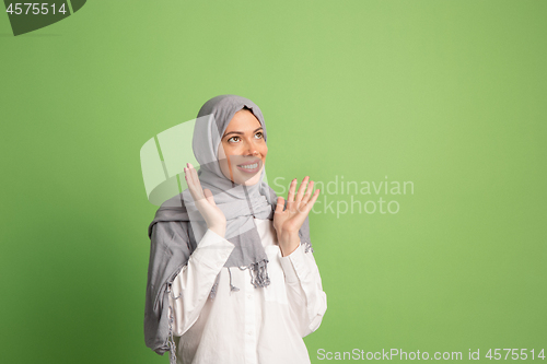 Image of Happy arab woman in hijab. Portrait of smiling girl, posing at studio background