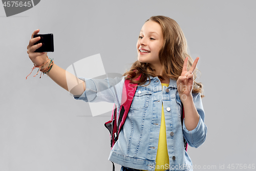 Image of teenage student girl taking selfie by smartphone