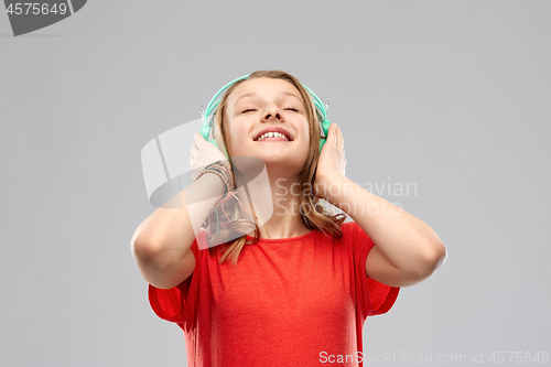 Image of happy teenage girl with headphones