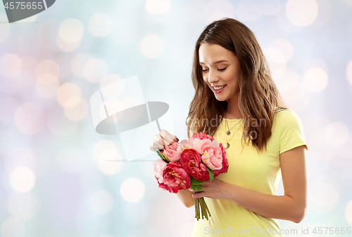 Image of young woman or teenage girl with flower bouquet