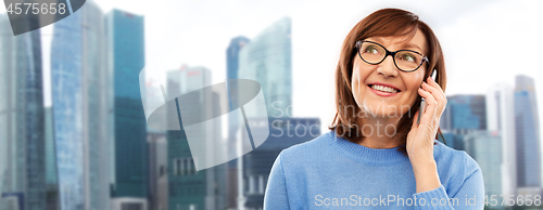 Image of senior woman calling on smartphone in singapore