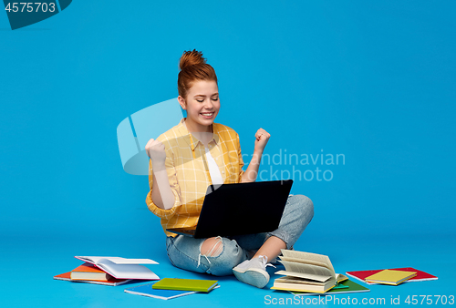 Image of happy student girl with laptop celebrating success