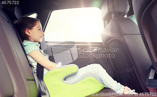 Image of family with child in safety seat driving car