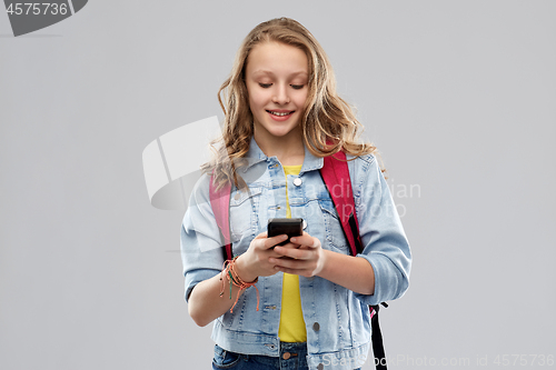 Image of teen student girl with school bag and smartphone