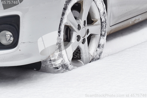 Image of Car tyre in snow