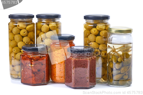 Image of Olives, pesto, dried tomatoes on white background