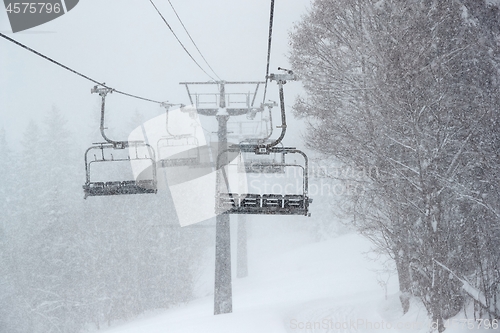 Image of Ski lift in falling snow