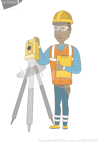 Image of African surveyor builder working with theodolite.