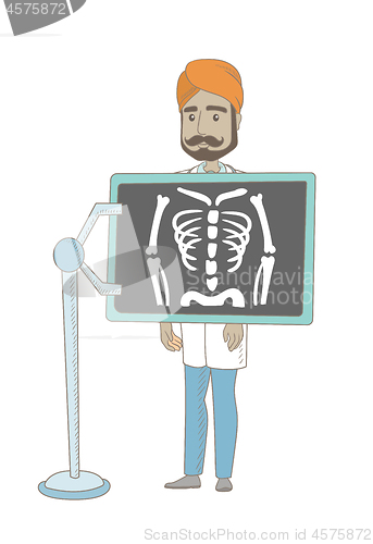 Image of Indian roentgenologist during x ray procedure.