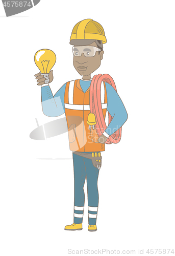 Image of Young african electrician holding a lightbulb.