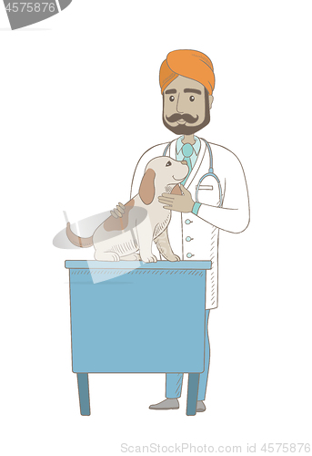 Image of Young indian veterinarian examining dog.