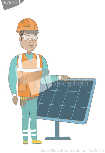 Image of Young hispanic worker of solar power plant