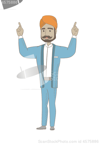 Image of Hindu businessman standing with raised arms up.