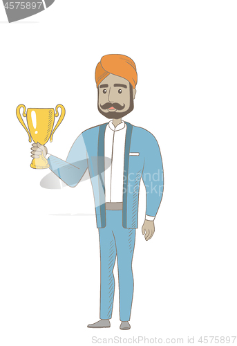 Image of Hindu businessman holding a trophy.