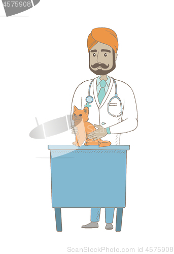 Image of Young indian veterinarian examining cat.