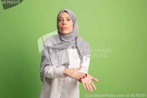 Image of Argue, arguing concept. arab woman in hijab. Portrait of girl, posing at studio background