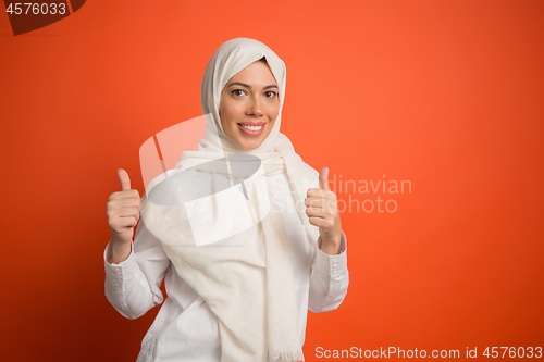 Image of Happy arab woman in hijab. Portrait of smiling girl, posing at studio background