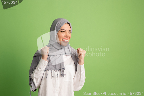 Image of Happy arab woman in hijab. Portrait of smiling girl, posing at studio background