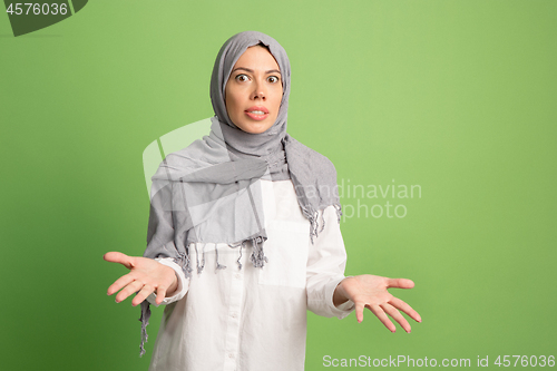 Image of Argue, arguing concept. arab woman in hijab. Portrait of girl, posing at studio background