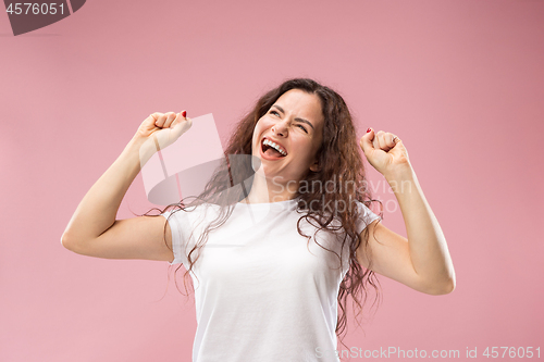 Image of Winning success woman happy ecstatic celebrating being a winner. Dynamic energetic image of female model