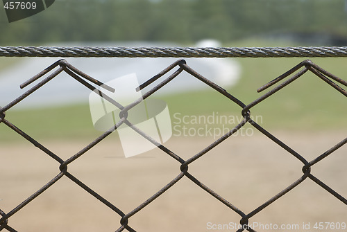 Image of Detail of rusty wire fence