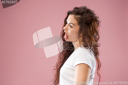 Image of Beautiful woman in stress isolated on pink