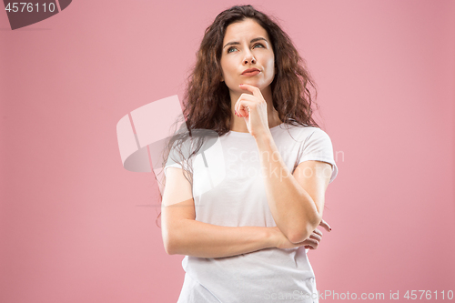 Image of Young serious thoughtful business woman. Doubt concept.