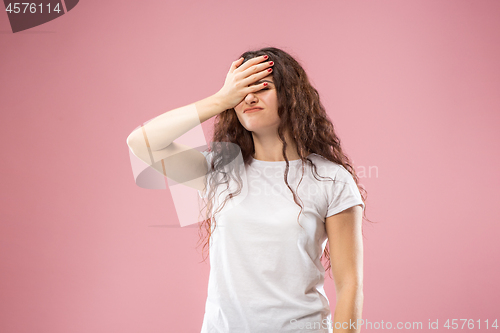 Image of Beautiful woman looking bewildered isolated on pink