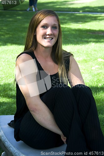 Image of Beautiful Girl in the Park in a Black Dress