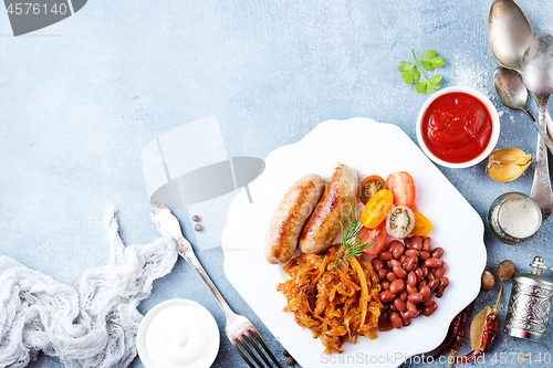 Image of sausages with fried cabbage