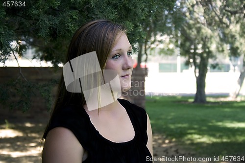 Image of Beautiful Girl in the Park in a Black Dress
